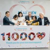 Don Lam, CEO and Founding Partner of VinaCapital, Chair of the VCF Board (first from right), Former Vice President of Vietnam Truong My Hoa (second from rìght) and other donors at the ceremony to celebrate the saving of 11,000 kids with CHD. (Photo courtesy of Heartbeat Vietnam)
