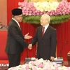 General Secretary Nguyen Phu Trong (right) receives Malaysian Prime Minister Anwar Ibrahim in Hanoi in July 2023. (Photo: VNA) 