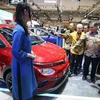 Coordinating Minister for Economic Affairs Airlangga Hartarto (second from left) looks at an electric vehicle at the 2024 Gaikindo Indonesia International Auto Show (GIIAS) in Tangerang, Banten, on July 24. (Photo: antaranews.com) 