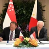 Singaporean Defence Minister Ng Eng Hen (right) and Philippine Secretary of National Defense Gilberto Teodoro Jr. signing the memorandum of understanding on July 24. (Photo: MINDEF) 