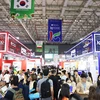 Visitors at a food exhibition. (Photo: VNA)