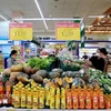 People shop at Co.opmart supermarket in Hanoi (Photo: VNA)