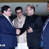 Indian officials welcome PM Pham Minh Chinh at the Palam Airbase in New Delhi. (Photo: VNA)