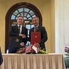 US Secretary of State Antony Blinken (left) and Singaporean Minister for Foreign Affairs Vivian Balakrishnan ink the deal on July 31. (Photo: CNA)