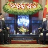 President To Lam (R) receives Chief Executive of China’s Hong Kong Special Administrative Region Lee Ka-chiu in Hanoi on August 1. (Photo: VNA)
