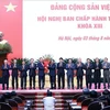 Politburo member and Prime Minister Pham Minh Chinh (seventh from right), on behalf of key leaders of the Party and State, presents flowers to congratulate President To Lam on being elected as General Secretary of the 13th Communist Party of Vietnam Central Committee (Photo: VNA).