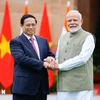 Indian Prime Minister Narendra Modi (R) meets Prime Minister Pham Minh Chinh (Photo: VNA)