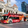 The hop-on hop-off buses in HCM City. The city is among the top destinations in Việt Nam that tourists from Australia want to visit. (Photo: VNA)