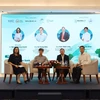 A panel discussion as part of the “Green Innovation in Factories and Industrial Parks: Going with the Flow for Sustainable Development” seminar in HCM City on August 8. (Photo courtesy of ITPC)