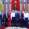 Party General Secretary and President To Lam (fifth, left) on August 15 meets with former guards and medical workers who served President Ho Chi Minh during the time he lived and worked at the Presidential Palace in Hanoi from 1954-1969. (Photo: VNA)