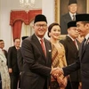 Indonesian President Joko Widodo (right) at the sworn-in ceremony of new cabinet members on August 19 (Photo: Getty Images/AFP) 