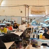 Vietnamese labourers working at the "Hanoi" garment factory , which is near conflict zones in Russia's Kursk oblast, are still working hard to ensure timely delivery of products to customers. (Photo: VNA)