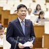 Deputy Prime Minister and Minister of Justice Le Thanh Long speaks at the hearing session of the 36th meeting of the National Assembly Standing Committee in Hanoi on August 21. (Photo: VNA)