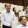 Minister of Culture, Sports and Tourism Nguyen Van Hung answers NA deputies question on August 21 (Photo: VNA)