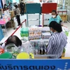 Customers buy medicine at a pharmacy in Bangkok. ( Photo: bangkokpost.com)