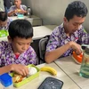 Indonesian students have free lunch at school. (Photo: Reuters)