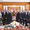 A delegation of the Lao Ministry of Foreign Affairs comes to the Vietnamese Embassy to congratulate Vietnam on the 79th anniversary of its National Day. (Photo: VNA)