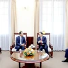 Deputy Prime Minister and Minister of Foreign Affairs Bui Thanh Son (R) receives Lao Deputy Minister of Foreign Affairs Phoxay Khaykhamphithoune. (Photo: VNA)