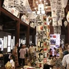 Artworks of calligraphy integrated with light technology are displayed at the Temple of Literature in Hà Nội. (Photo: Courtesy of the Temple of Literature) 