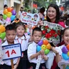 A teacher and students at Thang Long Primary School in Hanoi on September 5. (Photo: VNA)