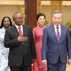 Party General Secretary and President To Lam (R), Guinea-Bissau President Umaro Sissoco Embaló and their spouses at the banquet. (Photo: VNA)