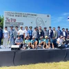 Delegates of the Tourism Association of Ninh Thuan province take a group photo at the 2nd Jeju International Super Cup Kitesboarding Competition. (Photo: Tourism Association of Ninh Thuan province)