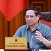 Prime Minister Pham Minh Chinh chairs a meeting between permanent cabinet members and the standing board of the sub-committee for socio-economic affairs of the 14th National Party Congress on September 9. (Photo: VNA)