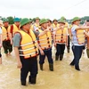 Prime Minister Pham Minh Chinh inspects the floods in Van Ha commune of Viet Yen township in the northern province of Bac Giang. (Photo: VNA) 