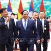 PM Pham Minh Chinh (R) and Party General Secretary and President of Laos Thongloun Sisoulith (Photo: VNA)