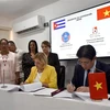 At the signing of the cooperation agreement between the Vietnam Bar Federation and the National Organisation of Collective Law Firms of Cuba (Photo: VNA)