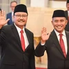 Inspector General Eddy Hartono (right) waves to reporters before their inauguration as Head of the National Counter-Terrorism Agency (BNPT) by President Joko Widodo at the State Palace, Jakarta. (Photo: jakartaglobe.id)