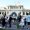 Korean tourists visit the central post office, a famous destination in Ho Chi Minh City. (Photo: VNA)