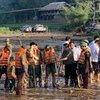 Prime Minister Pham Minh Chinh during his on-site inspection of the search and rescue operation in Lao Cai province's Lang Nu village, which was hit by a devastating landslide that buried 37 households and left 95 people dead or missing, on September 12 afternoon. (Photo: VNA)