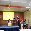 Staff at Vietnamese Embassy in Thailand and other organisations at the fundraising event. (Photo: VNA)