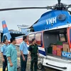 Relief supplies being loaded onto a helicopter at Gia Lam Airport (Hanoi). (Photo: Military News Agency/VNA)