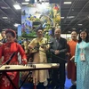 A traditional musical instrument performance at the Vietnam pavilion. (Photo: VNA)