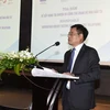 Truong Hung Long, Director of the Department of Debt Management and External Finance under the Ministry of Finance, speaks at the seminar. (Photo: mof.gov.vn)