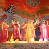 "Ao dai" show at the festival. (Photo: VNA)