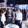 Vietnamese and Chinese officials visit booths of Vietnamese enterprises at the third GDTE. (Photo: thoibaotaichinhvietnam.vn)