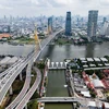 A view of the Bhumibol bridge (left) over the Chao Phraya river and an under-construction high-rise building (right) in the backdrop of Bangkok's skyline. (Photo: AFP) 