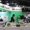 A booth showcasing advanced technologies at the exhibition. (Photo: VNA)