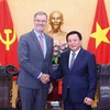 HCMA President Nguyen Xuan Thang and French Ambassador Olivier Brochet at their meeting in Hanoi on September 25. (Photo: VNA)