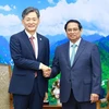 PM Pham Minh Chinh (R) and KPNA Commissioner General Cho Ji-ho. (Photo: VNA)