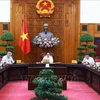 PM Pham Minh Chinh chairs a meeting between the permanent cabinet members and the steering committee for developing the project on regional and international financial centres on September 30. (Photo: VNA)