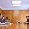 Secretary of the Communist Party of Vietnam (CPV) Central Committee and head of its Commission for External Relations Le Hoai Trung (second, left) hold working sessions with Vice Chairman of the Mongolian Democratic Party (MoDP) Batchimeg (third, right)on October 1. (Photo: VNA)