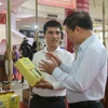 Trade fairs provide excellent opportunities for businesses to promote their products. (Photo: VietnamPlus)