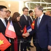 Staff of the Vietnamese Embassy in France welcome Party General Secretary and State President To Lam at Orly airport in Paris (Photo: VNA)