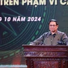 Prime Minister Pham Minh Chinh addresses the launching ceremony of the "Mai am cho dong bao toi" movement on october 5. (Photo: VNA)