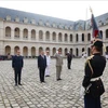 Party General Secretary and State President To Lam (C) reviews the guard of honour. (Photo: VNA)