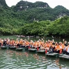 Tourists at the Trang An Scenic Landscape Complex in Ninh Binh province (Photo: VNA)